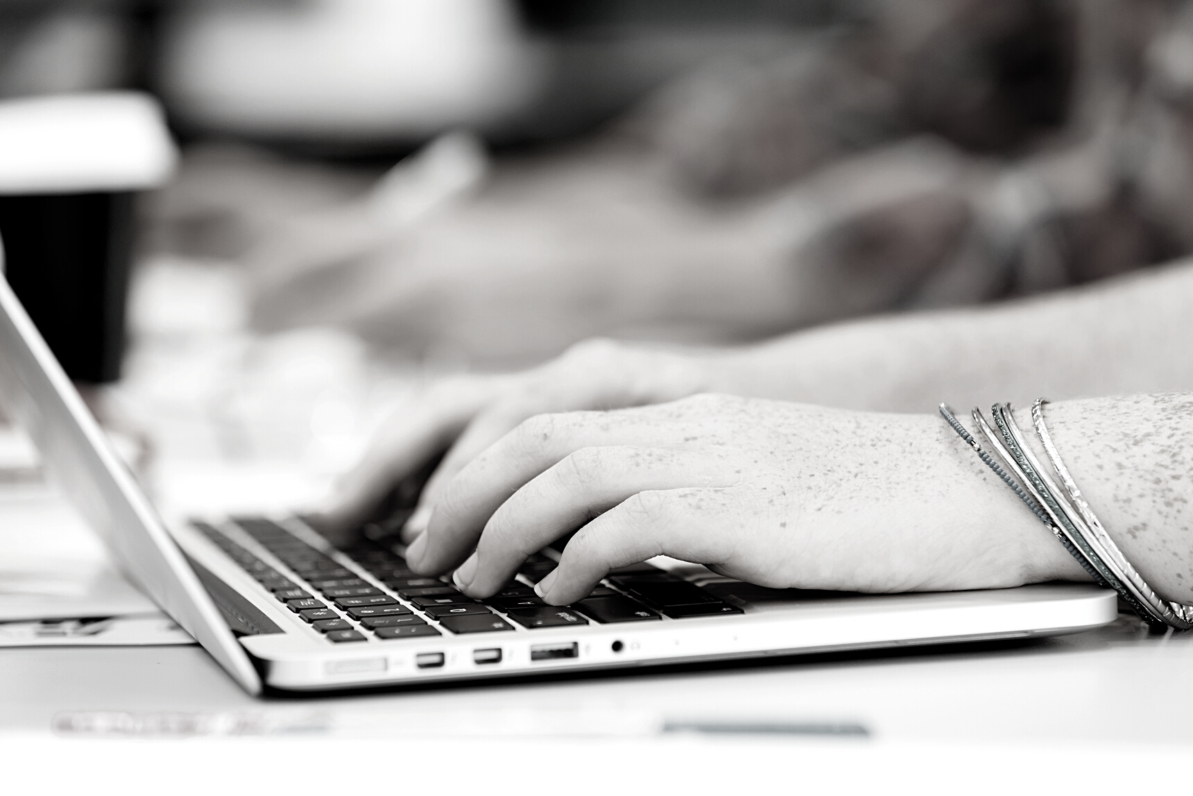 Hands Typing on the Keyboard